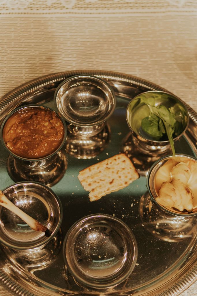 Intriguing Seder plate featuring symbolic items, perfect for illustrating Passover traditions and celebrations.